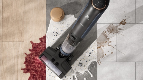 Man vacuuming carpet